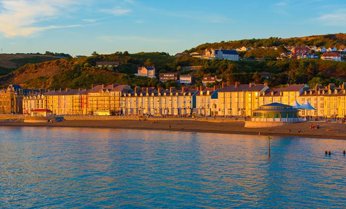 Hotel exterior overlooking the seafront at sunset